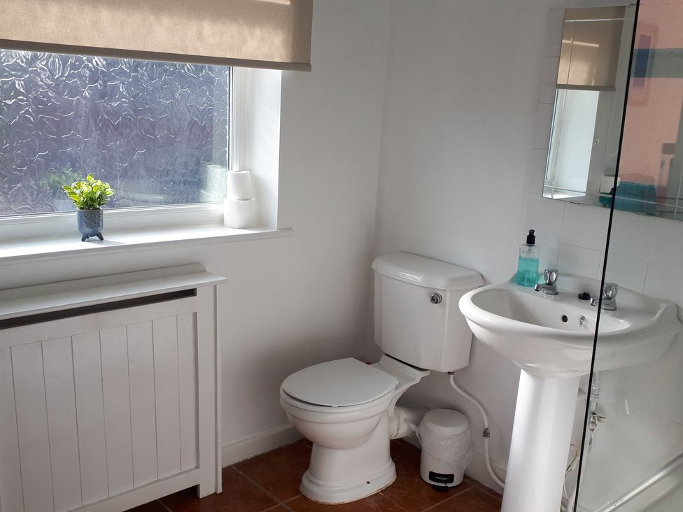 A bathroom with a sink and toilet at tbc 