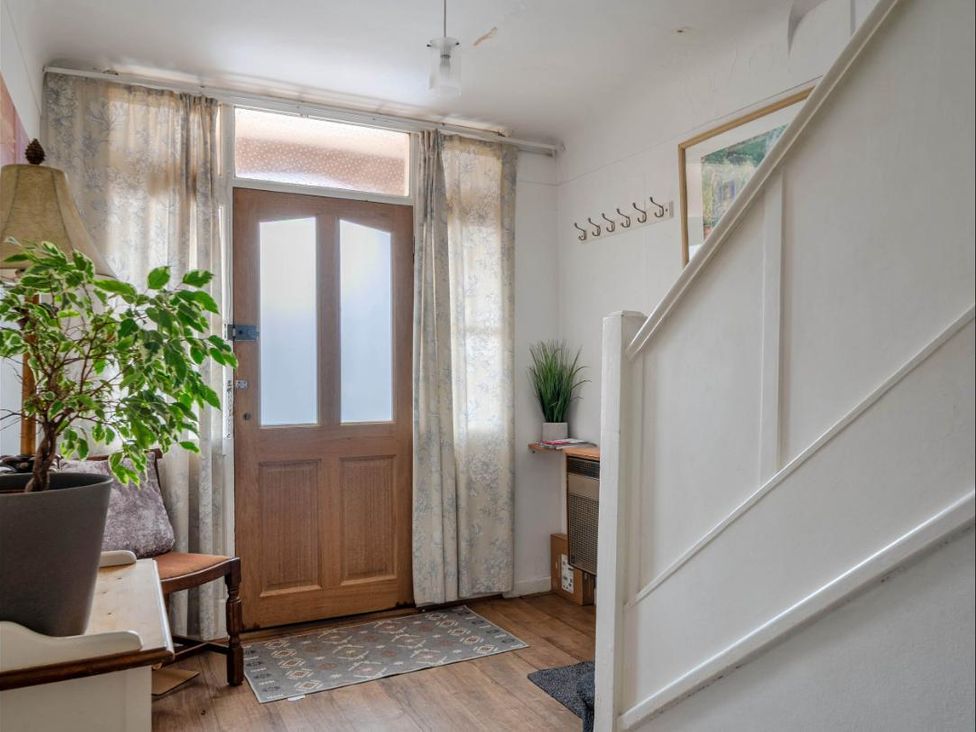 A hallway with a door and plant at Village retreat with canal walk into Chester, Christleton