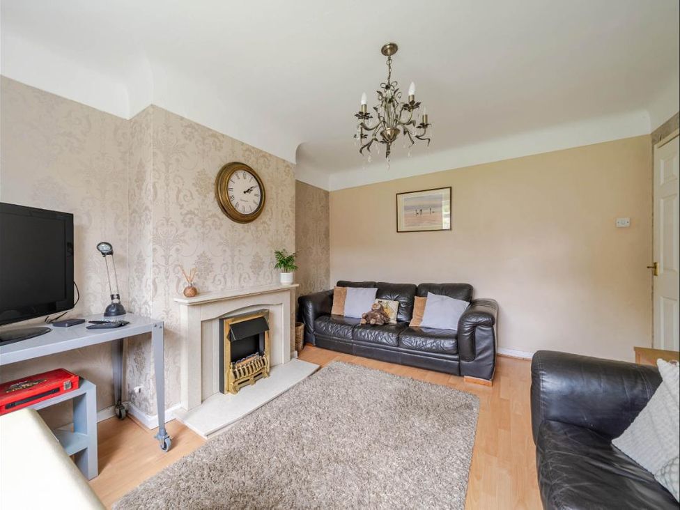 A living room with a sofa and TV at Village retreat with canal walk into Chester in Christleton