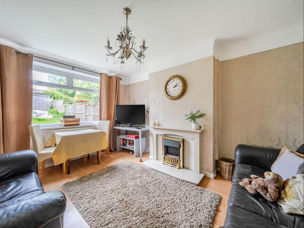 A living room with a sofa, table, and television at Village retreat with canal walk into Chester, Christleton