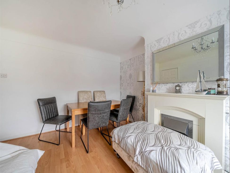 A dining room with a table and chairs at Village retreat with canal walk into Chester, Christleton