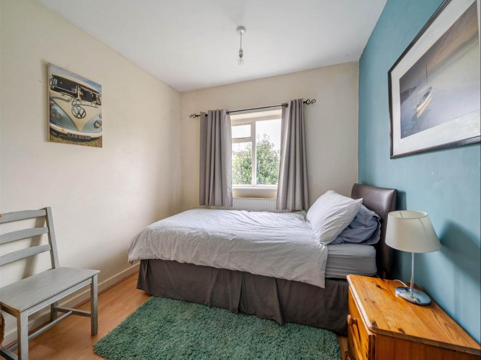 A bedroom with a bed and window at Village retreat with canal walk into Chester in Christleton