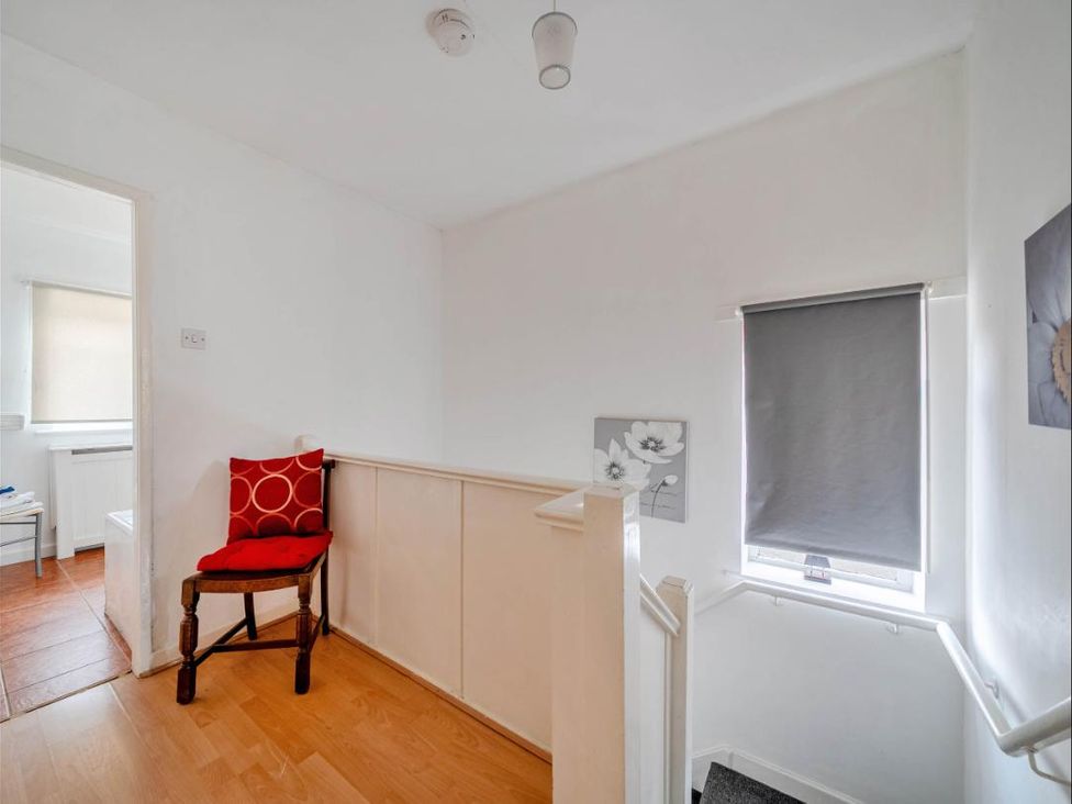 A hallway with a chair and stairway at Village retreat with canal walk into Chester, Christleton