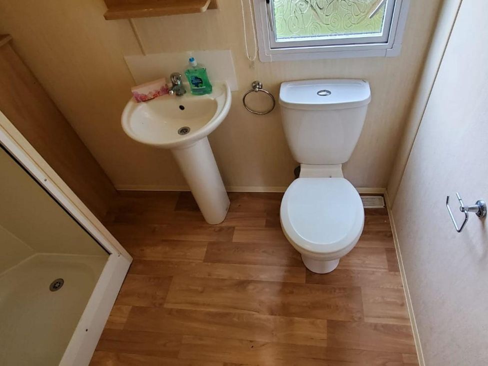 A bathroom with a sink and toilet at tbc in 