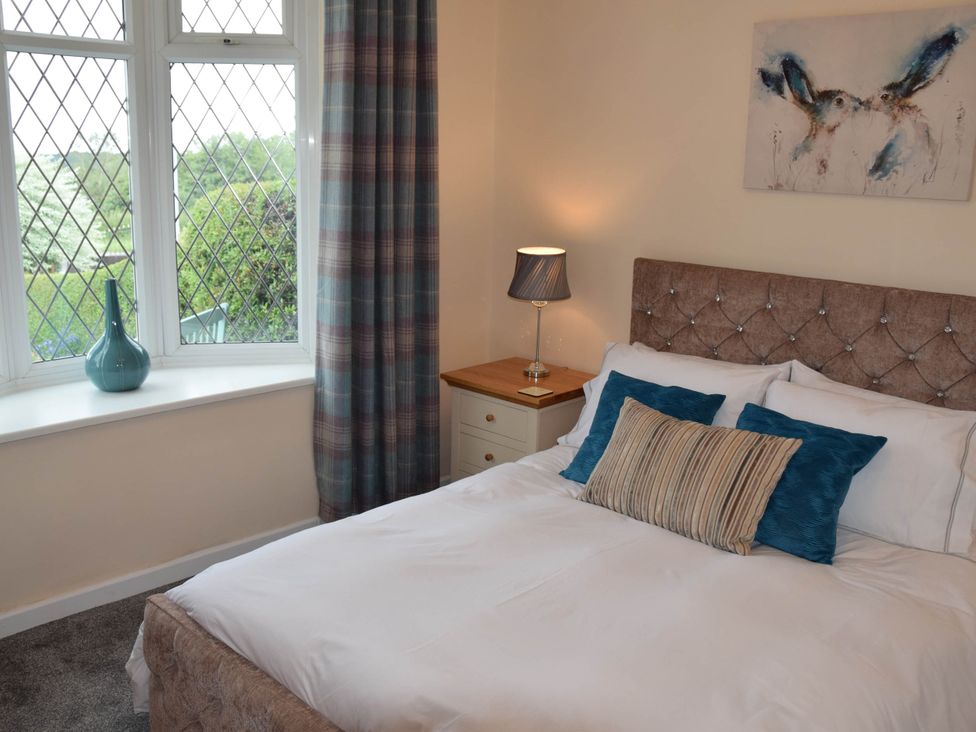 A bedroom with a bed and window at tbc 