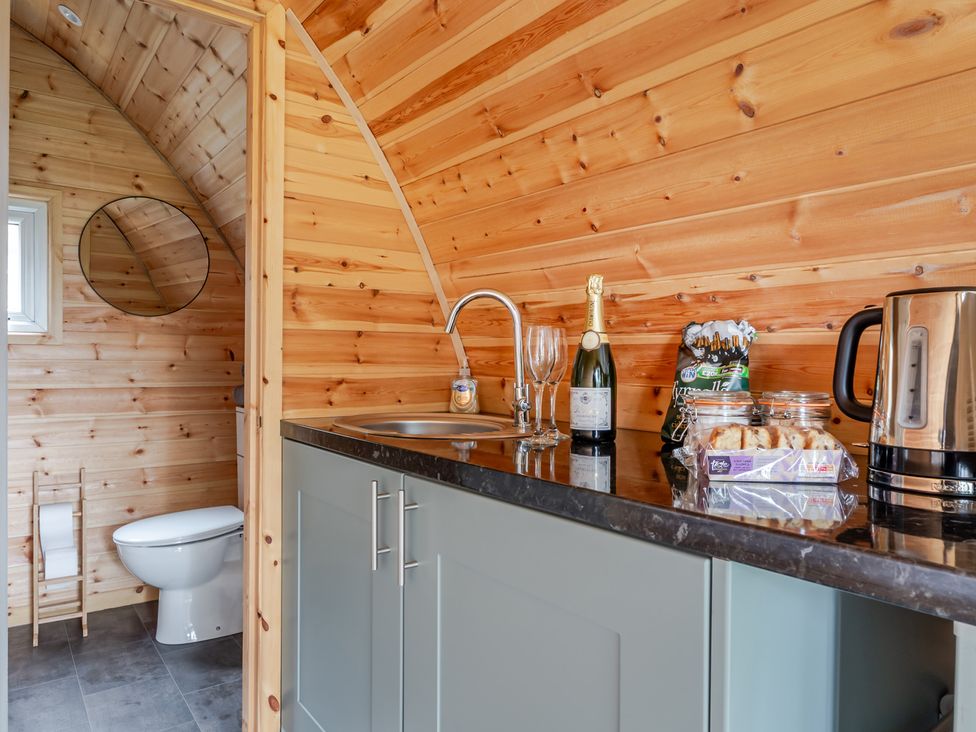 A bathroom with a sink and toilet at Peaceful pod with bay views, walk to 3 beaches in St Ives