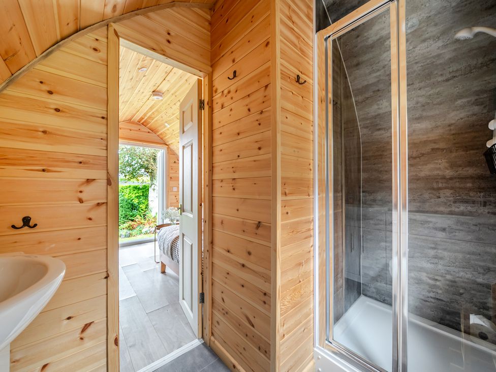 A bathroom with a shower and sink at Peaceful pod with bay views, walk to 3 beaches, St Ives