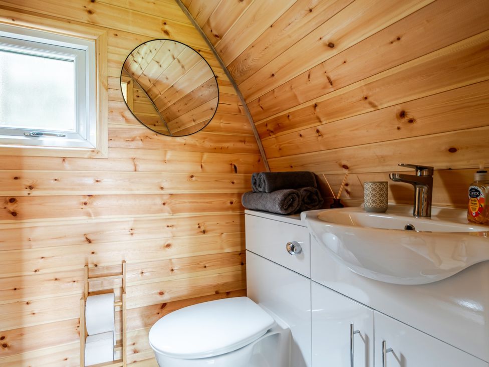 A bathroom with a sink and toilet at Peaceful pod with bay views, walk to 3 beaches St Ives