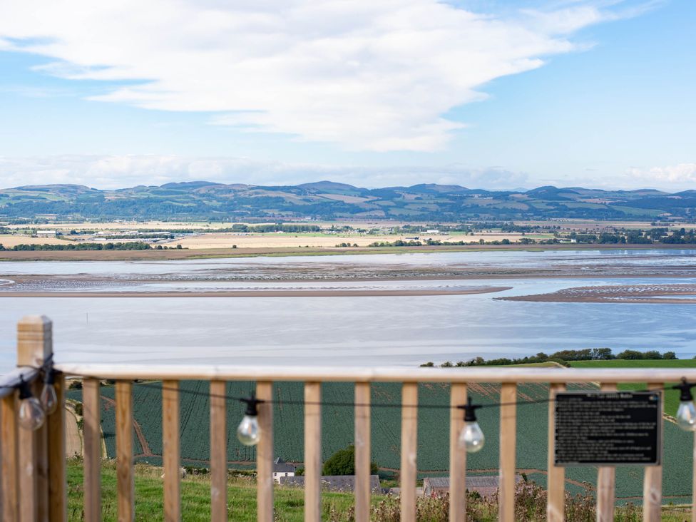 A landscape view of a river and hills at tbc in 
