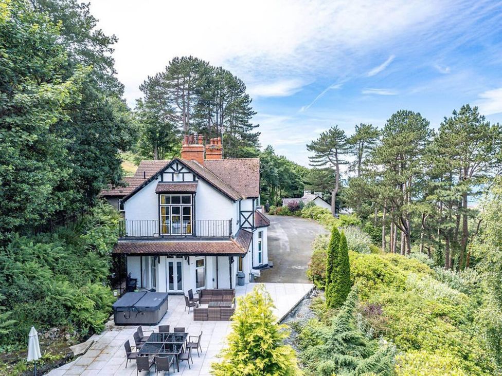 A house with a garden and patio area at tbc