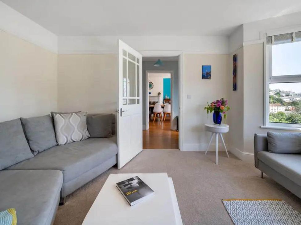 A living room with a sofa and coffee table at tbc in 