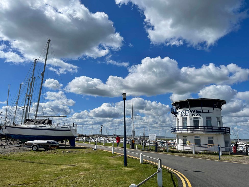 A marina with yachts and a building at Bradwell Marina in 