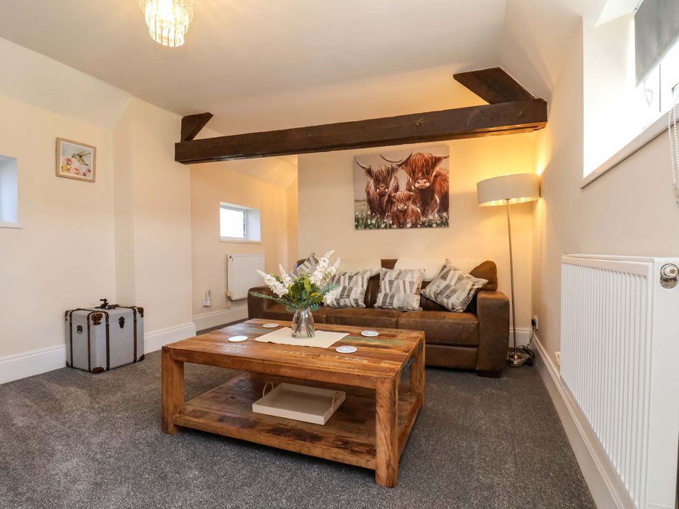 A living room with a sofa and coffee table at Lamb Cottage in Stockton-On-Tees