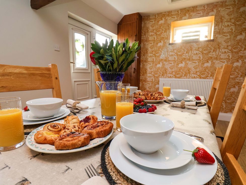A dining room with a table set for breakfast at Lamb Cottage Stockton-On-Tees