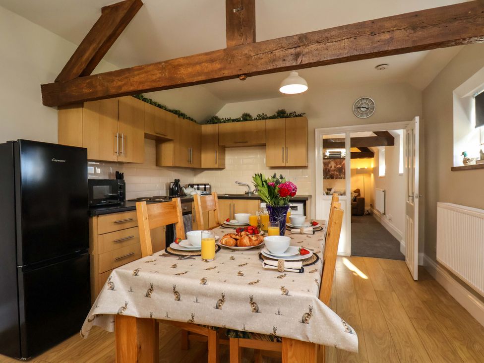 A kitchen with a dining table and chairs at Lamb Cottage Stockton-On-Tees