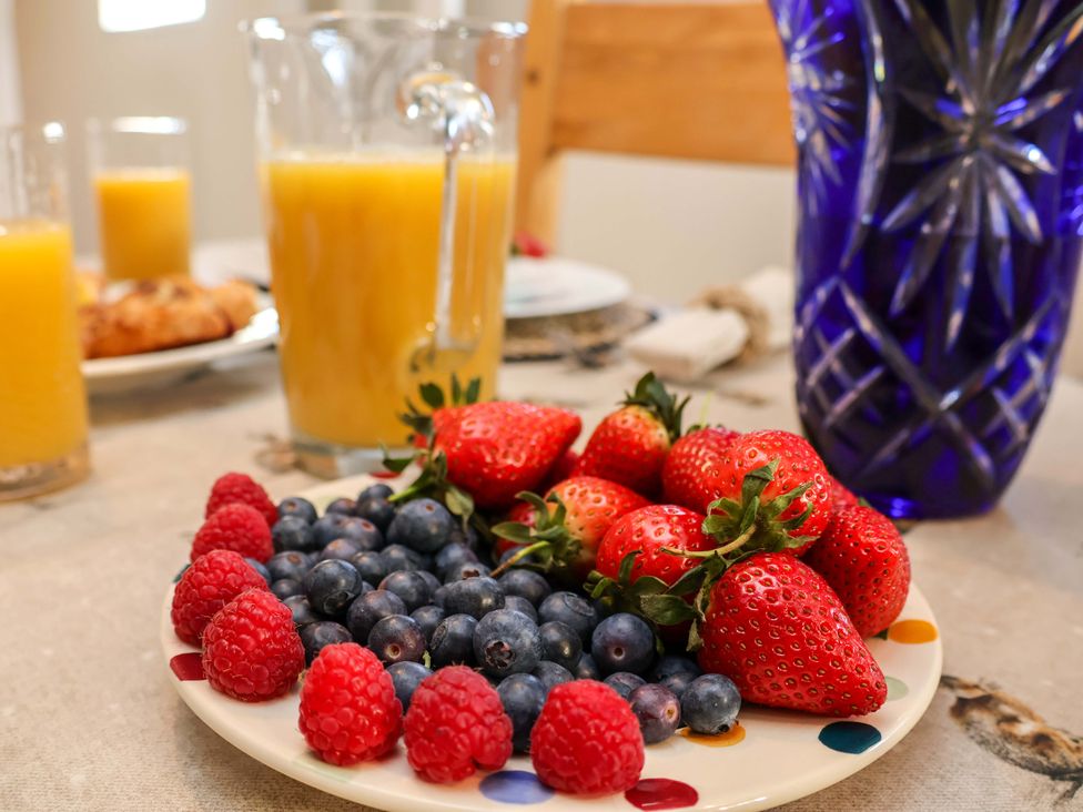 A plate of berries and drinks at Lamb Cottage in Stockton-On-Tees