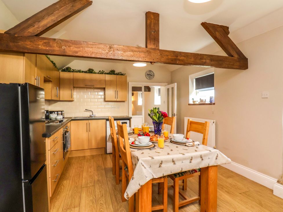 A kitchen with a dining table and chairs at Lamb Cottage Stockton-On-Tees