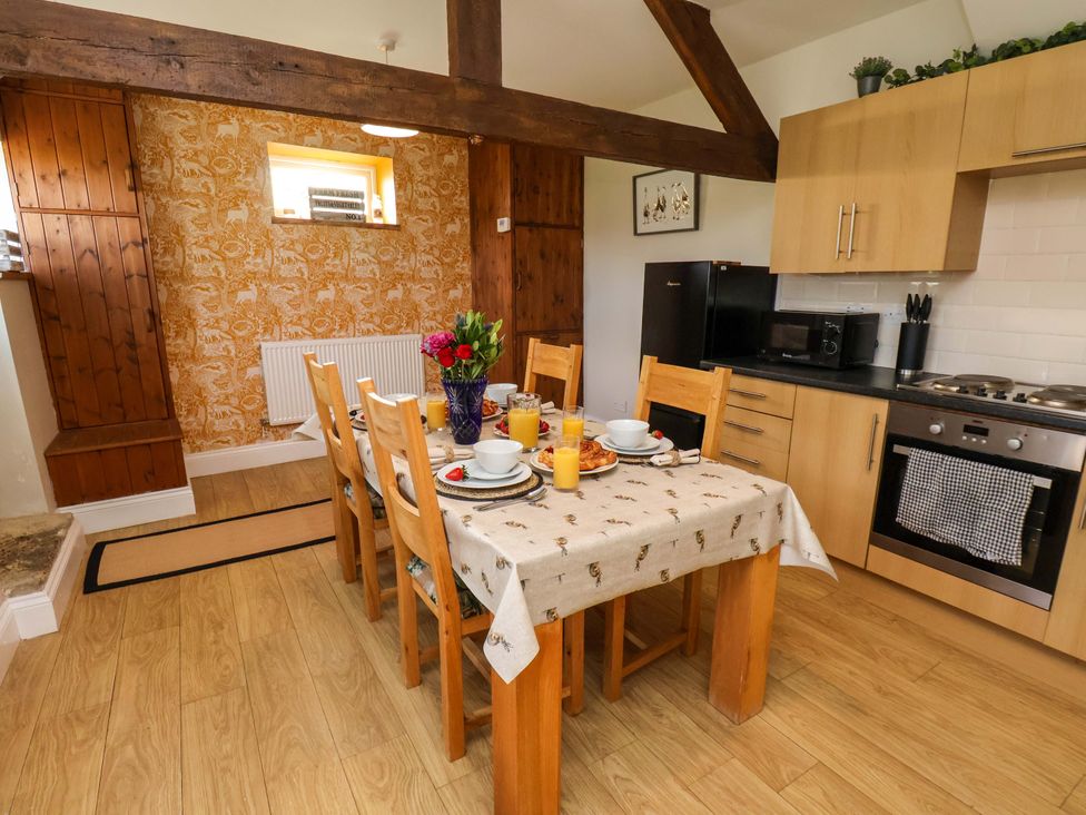 A kitchen with a dining table set for breakfast at Lamb Cottage Stockton-On-Tees