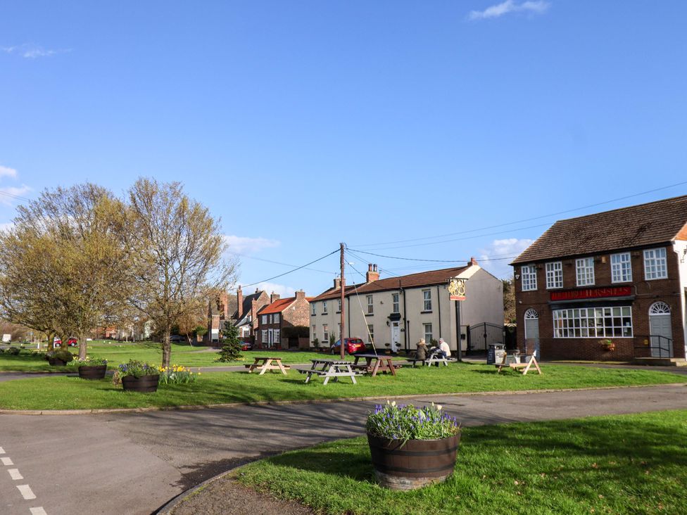 A village setting with houses and benches at Lamb Cottage Stockton-On-Tees