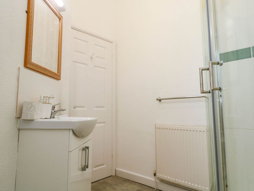 A bathroom with sink and shower at Flat 2 Penzance