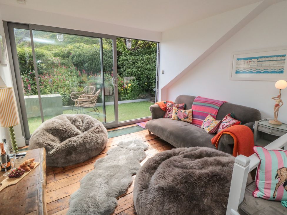 A living room with bean bags and a sliding door at Hillsover in Saltburn-by-the-Sea