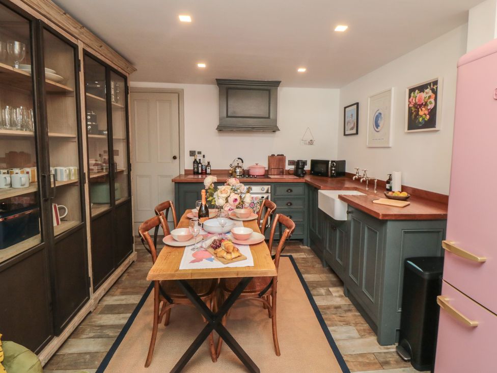 A kitchen with a table and chairs at Hillsover in Saltburn-by-the-Sea
