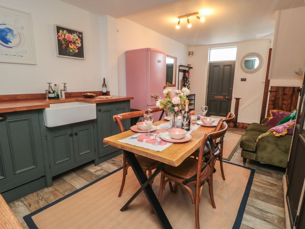 A kitchen with a dining table and chairs at Hillsover Saltburn-by-the-Sea