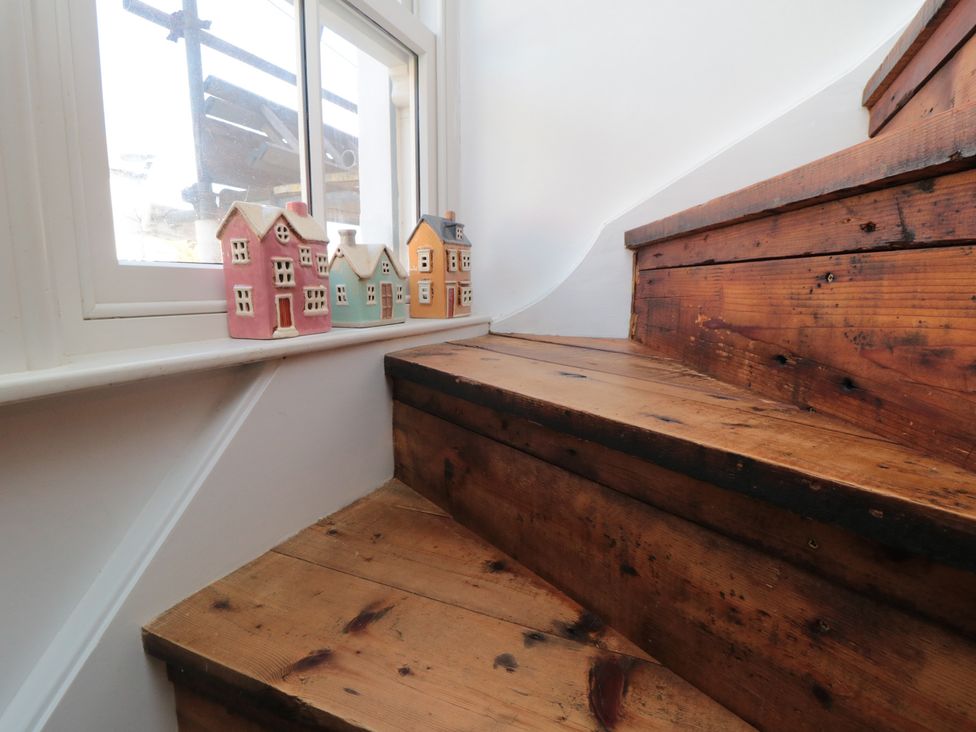 A staircase with wooden steps and decorative houses at Hillsover, Saltburn-by-the-Sea