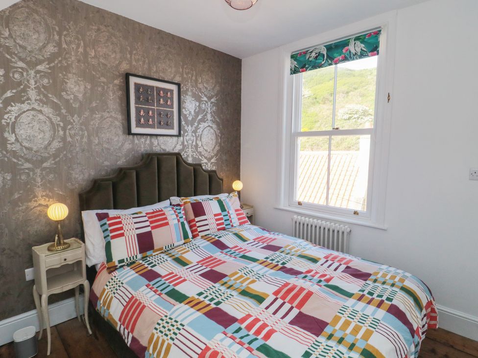A bedroom with a bed and bedside table at Hillsover Saltburn-by-the-Sea