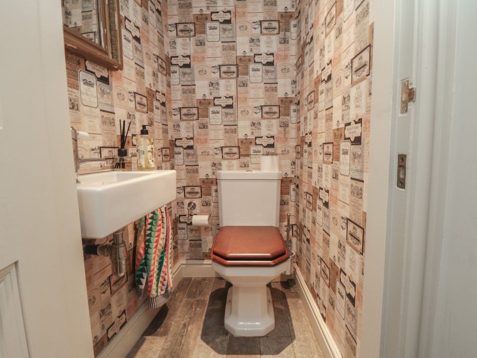 A bathroom with a toilet and sink at Hillsover in Saltburn-by-the-Sea