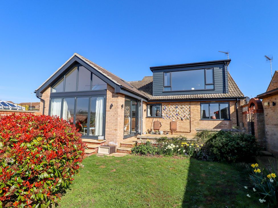 A house with a garden and windows at Seascape Hunstanton