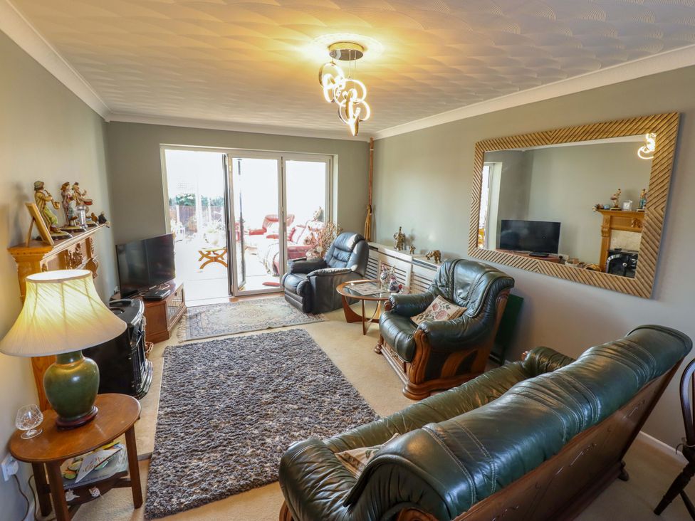 A living room with sofa and coffee table at Seascape in Hunstanton