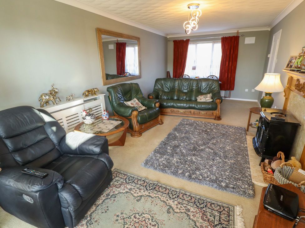 A living room with sofas and a coffee table at Seascape Hunstanton