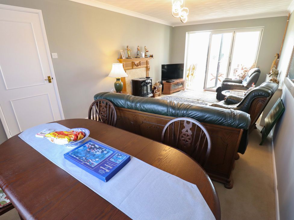 A living room with sofa and television at Seascape in Hunstanton