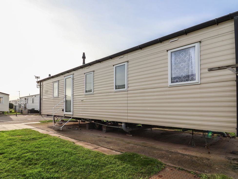 A mobile home with steps and windows at Away Resorts - Golden Sands Holiday Park, Rhyl