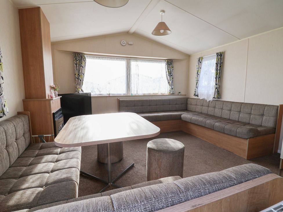 A living room with a sofa and table at Away Resorts - Golden Sands Holiday Park, Rhyl