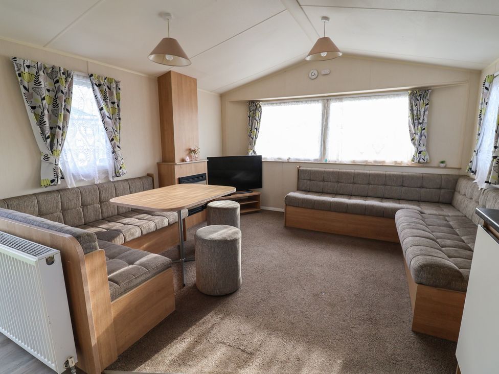 A living room with a sofa and coffee table at Away Resorts - Golden Sands Holiday Park, Rhyl