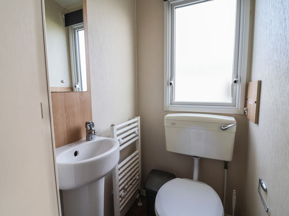 A bathroom with a sink and toilet at Away Resorts - Golden Sands Holiday Park, Rhyl