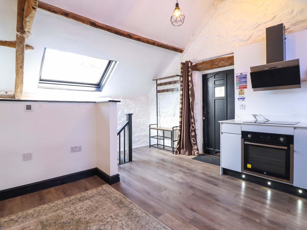 A kitchen area with a door and a window at The Lodge House at Rhiw Goch Inn Snowdonia National Park