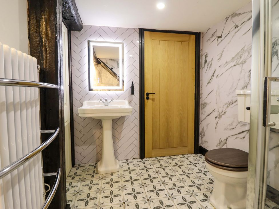 A bathroom with sink and toilet at The Lodge House at Rhiw Goch Inn in Snowdonia National Park