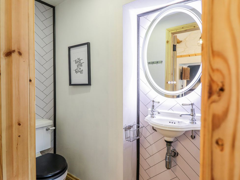 A bathroom with a toilet and a sink at The Romantic Hideaway at Rhiw Goch Inn, Snowdonia National Park