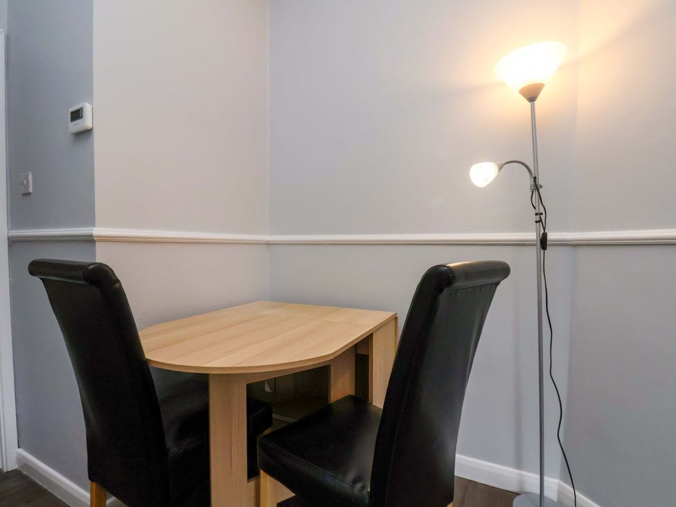 A dining room with a table and two chairs at 122B Norton Road Stockton-on-Tees