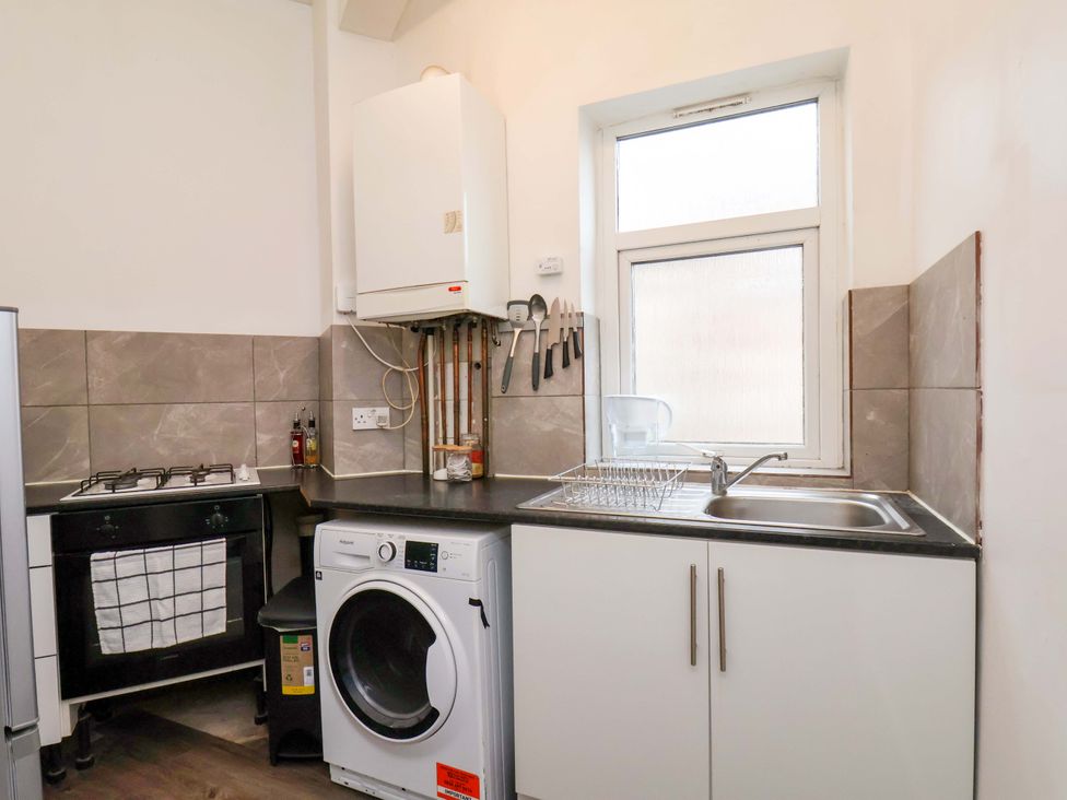 A kitchen with a sink and stove at 122B Norton Road Stockton-on-Tees