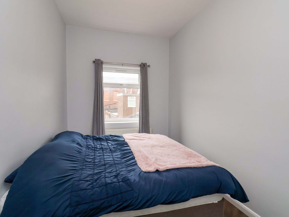 A bedroom with a bed and window at 122B Norton Road Stockton-on-Tees