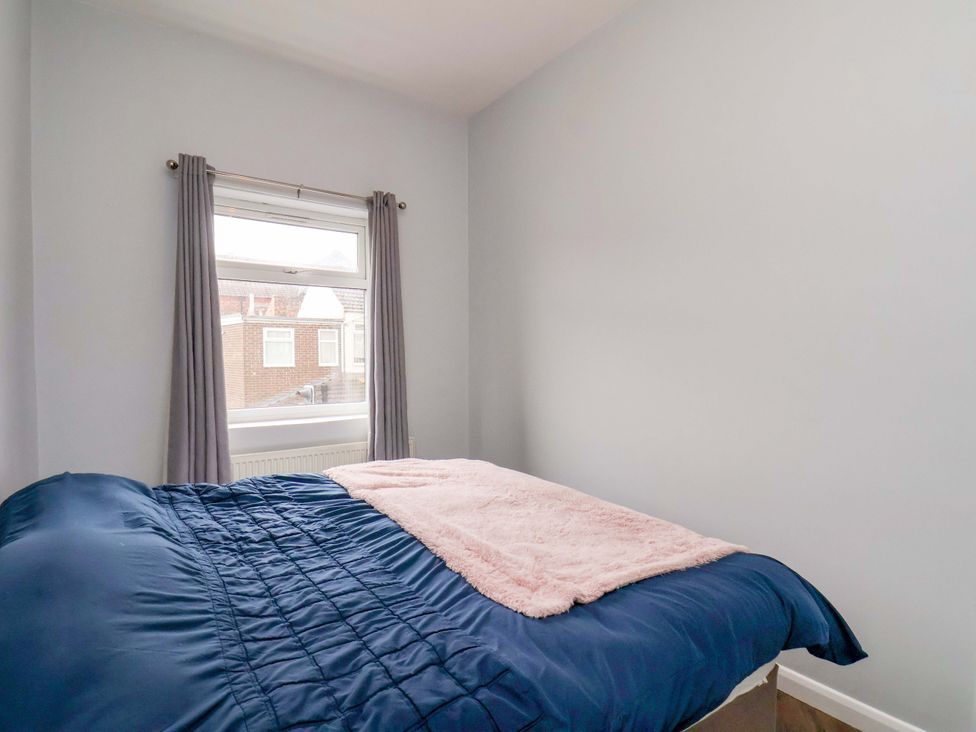 A bedroom with a bed and window at 122B Norton Road Stockton-on-Tees