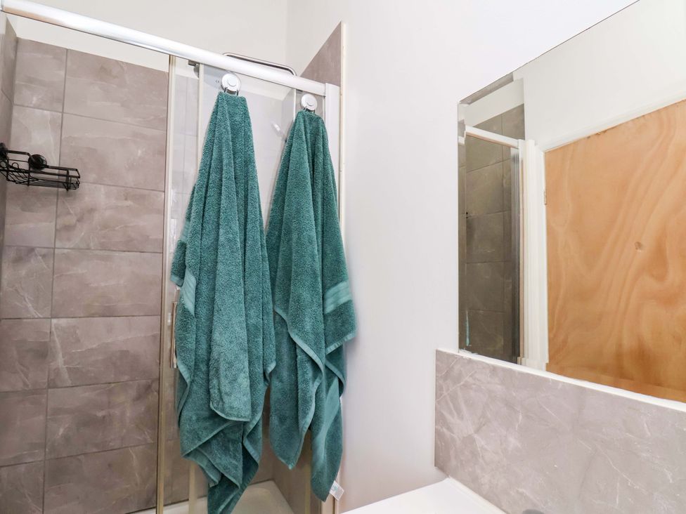A bathroom with towels hanging near the shower at 122B Norton Road Stockton-on-Tees