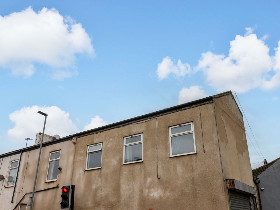 A building exterior with windows and a traffic light at 122B Norton Road Stockton-on-Tees