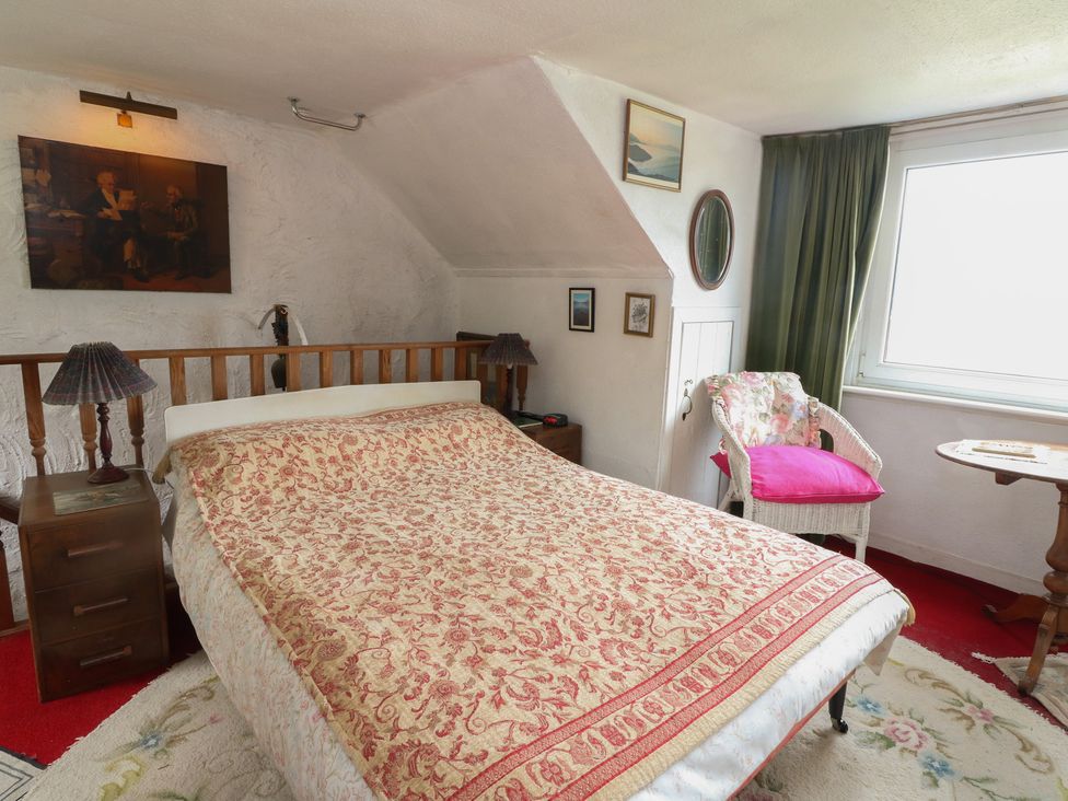 A bedroom with a bed and nightstand at 4 Whiterow Kentallen near Ballachulish