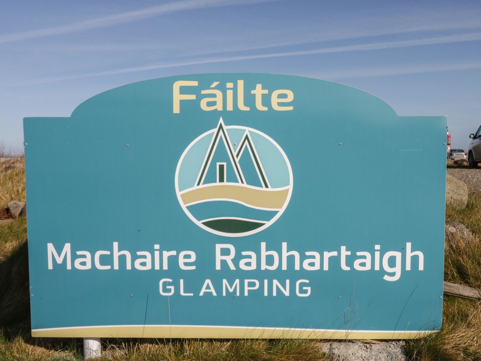 A sign for Machaire Rabhartach Glamping at Cabin 10 Inish Bo Finne in Gortahawk