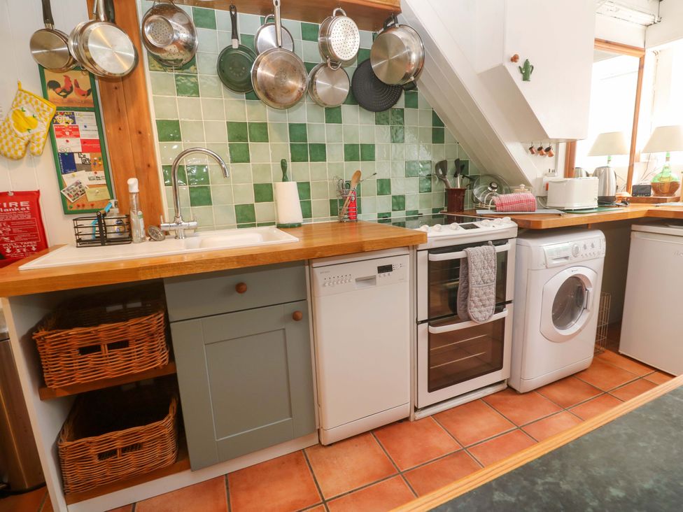 A kitchen with appliances and a sink at St. Dominic Cottage St. Ives